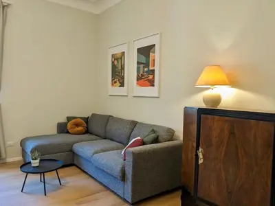 a living room with a couch and a table at Peaceful Roman Retreat in Rome