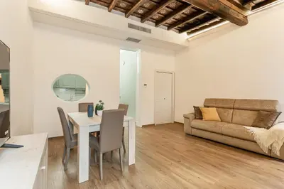 a living room with a table and a couch at iFlat Augustus Suite near Pantheon in Rome