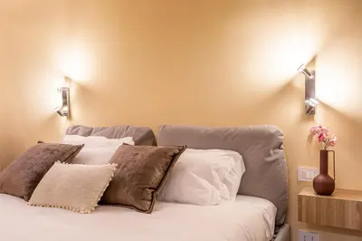 a bedroom with a bed with white pillows at iFlat Augustus Suite near Pantheon in Rome