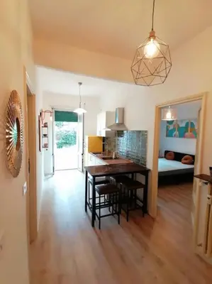 a kitchen and dining room with a table and chairs at Art House in Rome