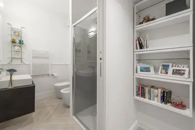 a bathroom with a shower and a toilet at Trevi Apartment in Rome