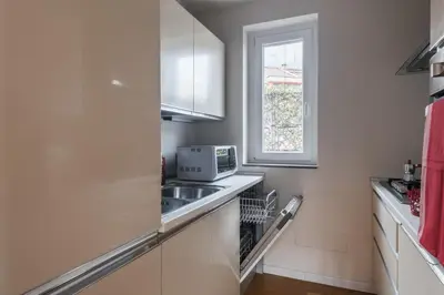 a kitchen with a sink and a microwave at Appartamento con terrazzo - vicino centro di Roma in Rome