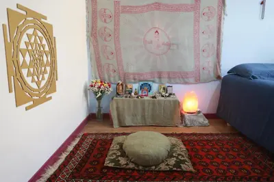 a room with a table and a bed and a rug at Lovely Sanctuary Central in Rome