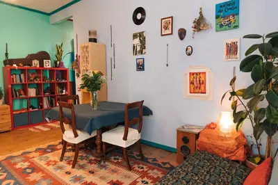 a dining room with a blue table and chairs at Lovely Sanctuary Central in Rome