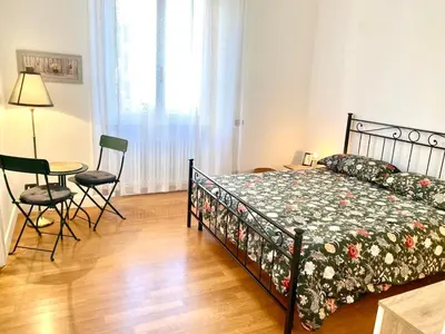 a bedroom with a bed and a table and chairs at A&G central stay in Rome
