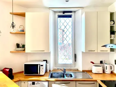 a kitchen with a sink and a window at A&G central stay in Rome