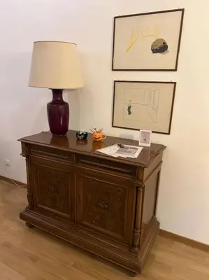 a table with a lamp on top of it at Casa di Nonna, Piazza Navona in Rome