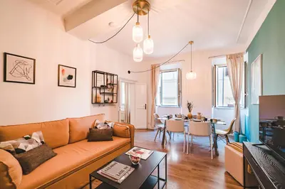 a living room with a couch and a table at Cosy Colosseum in Rome