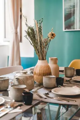 a table with a vase on top of it at Cosy Colosseum in Rome