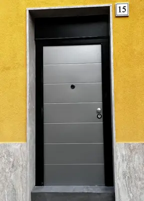 a black and white door with the number on it at Gold House Roma in Rome