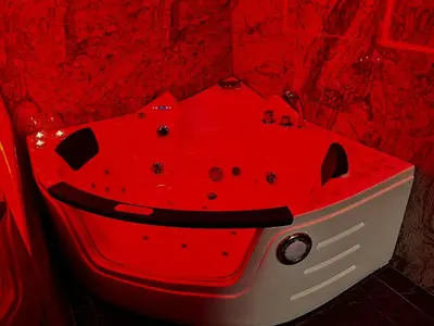 a red bath tub with a face painted on it at Gold House Roma in Rome