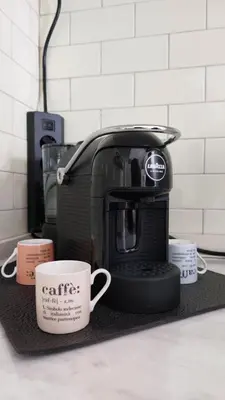 a coffee maker and two coffee cups on a counter at Way of Saying CASA in Rome