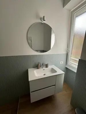 a bathroom with a white sink and a mirror at Maison Alteri in Rome