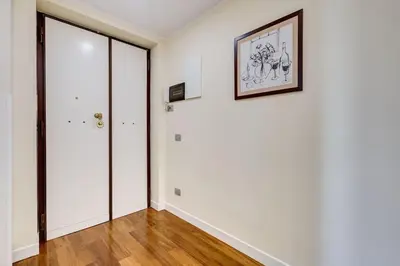 an empty room with white walls and a picture on the wall at BDC - Purple Apt at San Giovanni in Rome