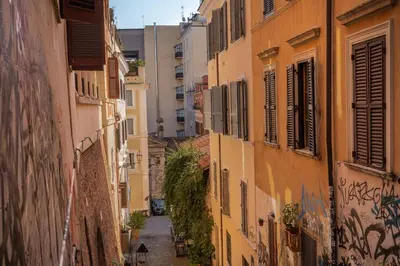 an alley in an old town with buildings at Ciancaleoni Gruppo M&L Apartments in Rome