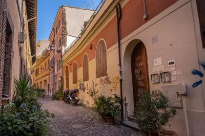 an alley in an old town with buildings at Ciancaleoni Gruppo M&L Apartments in Rome