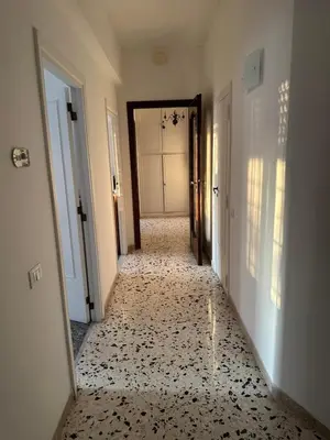 an empty hallway with a hallwayngthngthngthngthngthngthngthngthngthngth at Silvia's Home in Rome