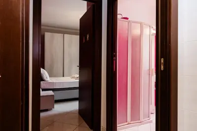 a room with a bathroom with a sink and a toilet at Romantic Malatesta in Rome