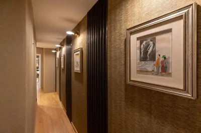 a hallway with a framed picture on a wall at Ara di Marte Home in Rome