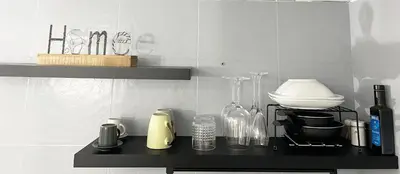 a black counter top with bottles and other items on it at HOME Sweet Home Vatican City in Rome