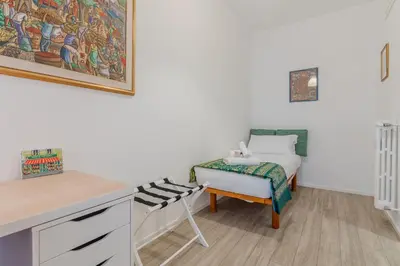 a room with a bed and a desk and a chair at Journalist Apartment Sistine Chapel in Rome