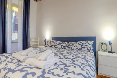 a bedroom with a bed with white towels on it at Cozy Flat Orso Navona square in Rome