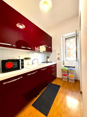 a room with a bedroom with a bed and a mirror at Gecko, cozy flat at 5min from Metro and 10min from Colosseum in Rome