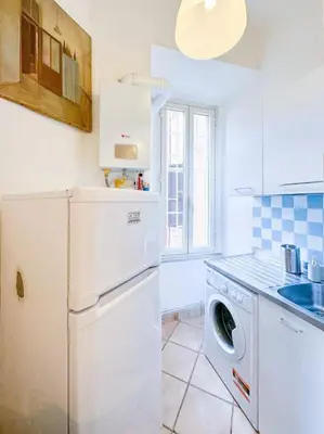 a kitchen with a dishwasher and a washer at Vatican Art Apartment in Rome