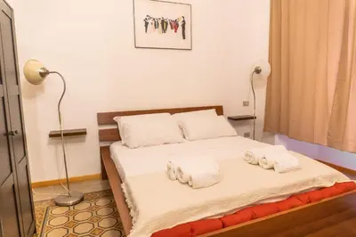 a bedroom with a bed with towels on it at Oasi artistica a Trastevere in Rome