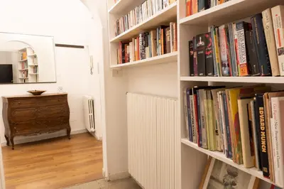 a hallway with book shelves filled with books at Oasi artistica a Trastevere in Rome