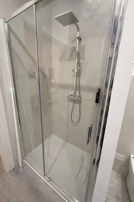 a shower with a glass door in a bathroom at Suite Maison San Pietro , Vaticano, AC & Wi-Fi in Rome