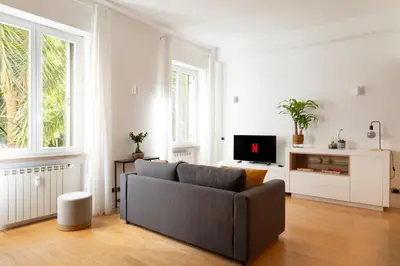 a living room with a couch and a tv at Casa Porta Metronia in Rome