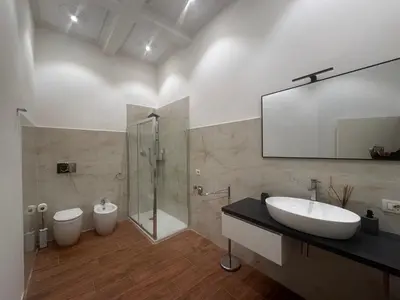 a bathroom with a sink and a shower and a toilet at Casa Angeli in Rome