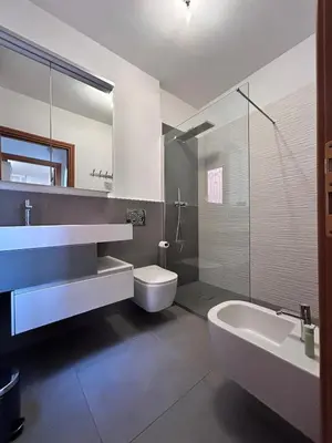 a bathroom with a sink and a toilet and a tub at Premium Apartment Papillo in Rome