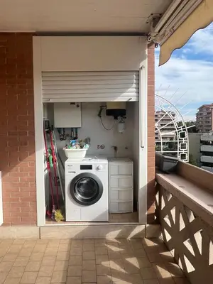 a washer and dryer sitting on a balcony at Premium Apartment Papillo in Rome