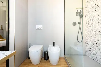 a bathroom with a toilet and a shower at YCH-Charming home near San Giovanni in Rome