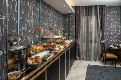 a buffet line with a variety of food on display at The Inn at the Spanish Steps Luxury Collection - Mario de' Fiori Home in Rome