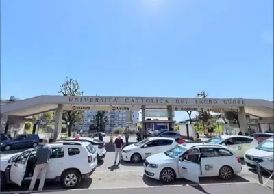 a group of cars parked in front of a car dealership at Gemelli Flower's House in Rome