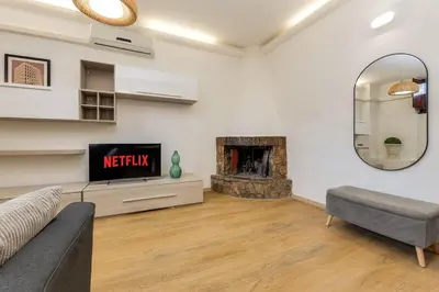 a living room with a couch and a fireplace at Trastevere Experience in Rome