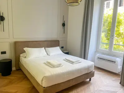 a bedroom with a bed with two towels on it at Vatican Boutique - 2 bedroom apartment - Trilocale in Rome