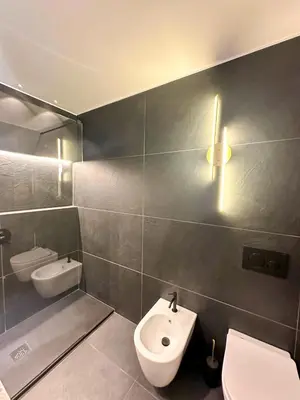 a bathroom with a white toilet and a sink at Vatican Boutique - 2 bedroom apartment - Trilocale in Rome