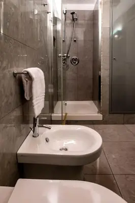 a bathroom with a toilet and a sink and a shower at Historic center apartment Rome in Rome