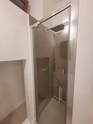 a shower with a glass door in a bathroom at Mini Loft MaDi' in Rome