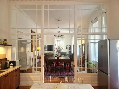 a kitchen and dining room with a dining table at Angel's Garden in Rome