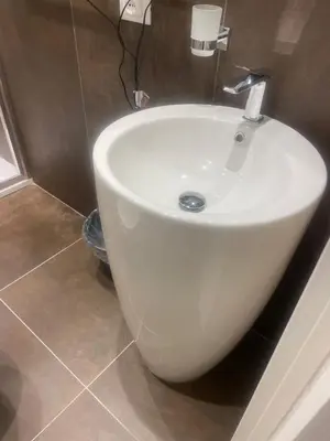 a white bath tub in a bathroom with a sink at Stazione Tiburtina Roma in Rome
