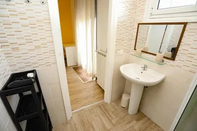 a bathroom with a sink and a mirror at Domus Antica Trastevere in Rome