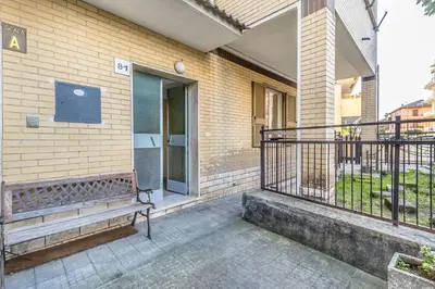 a balcony with a bench next to a building at A Casa di Max - Battistini Station 