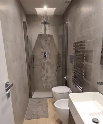 a bathroom with a shower and a toilet and a sink at Trastevere incantevole con patio esterno privato in Rome