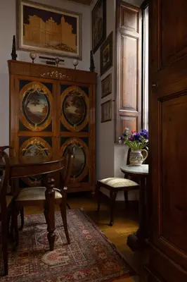 a staircase in a house with a chair at NOBILIA - Roof Garden Penthouse near Navona Square in Rome