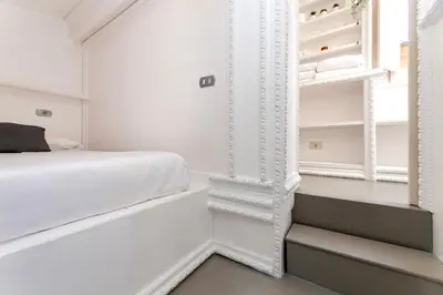 a bathroom with a sink and a mirror at Condotti Loft - city center in Rome